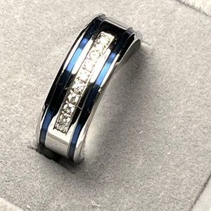 Stainless Steel in silver and blue with cz’s in an eternity band ring size 10